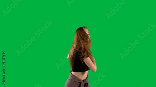 Beautiful woman dancing against black background