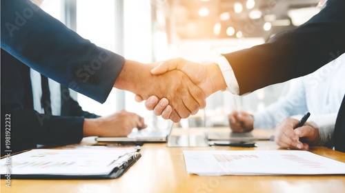 Diplomacy negotiation teamwork professional exchanging ideas across desk no faces visible corporate environment balanced lighting