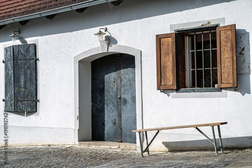 Rustic building with a bench.