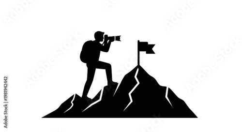 Man standing on mountain taking photo.