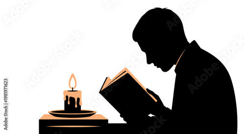 Man reading book by candlelight.