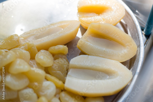 Closeup to Sake in syrup in tray