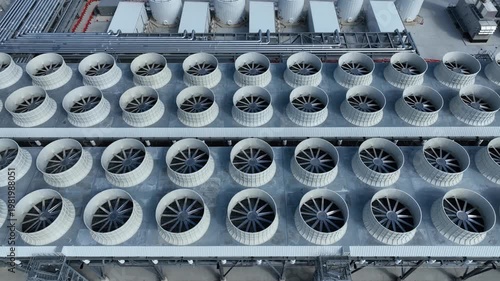 top down view of a bank of chilling tower fans at a AI datacenter with some chilling fans active and others idle as the data center is starting to come online