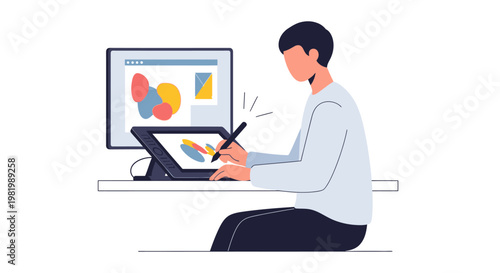 Graphic designer working on digital tablet with stylus and computer monitor