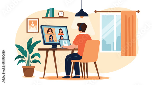 Young man participates in a video conference from his tidy home office using a computer while sitting in a comfortable modern chair.