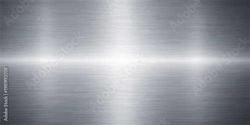 A polished silver stainless steel plate with a brushed metal texture featuring a shiny industrial aluminum surface pattern on a gray metallic backdrop