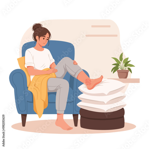 A sad woman sitting in a chair resting her injured foot on a stack of pillows