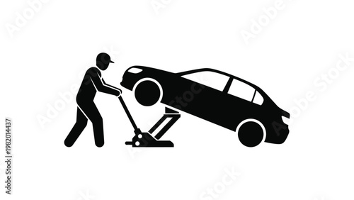 Mechanic lifting a car with a jack.