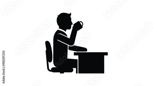 Man sitting at desk drinking coffee.