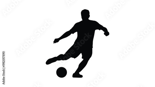 Silhouette of a man kicking a soccer ball.