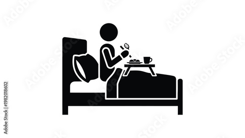 Person relaxing in bed with breakfast.