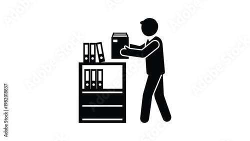 Man working at a filing cabinet.