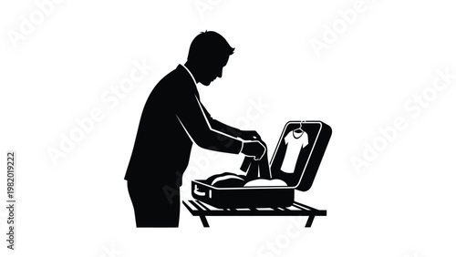 Man packing a suitcase for travel.