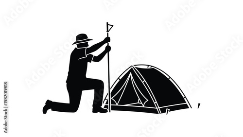 Man setting up a tent outdoors.