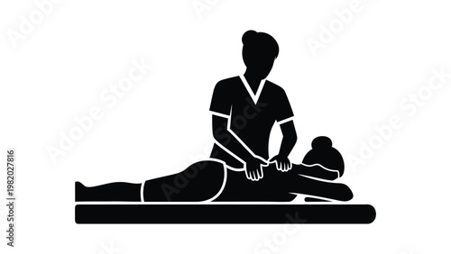 Massage therapist working on a client.