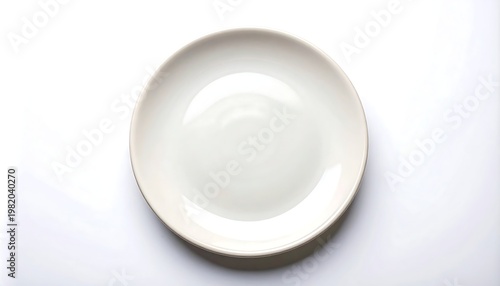 Simple white round plate centered on a bright white surface, minimal shadows under its edge
