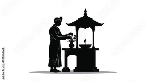 Buddhist monk lighting incense stick.