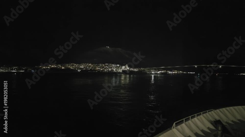 Sailing into Tromsø at night