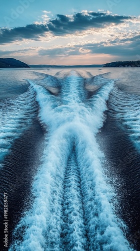 The wake of the boat on the blue water conveys a sense of speed, creating an inspiring backdrop for sea voyages.