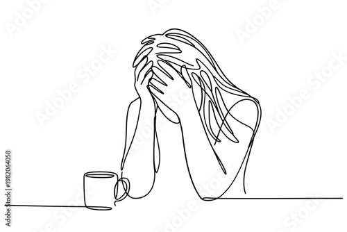 Woman overwhelmed with emotion head in hands and a nearby coffee cup