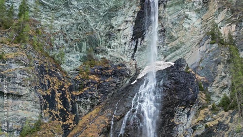 Aerial view of Jungfernsprung Waterfall in forest mountain. Austrian Alps, Austria, 4k