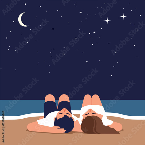 A couple lies on the beach sand at night, gazing up at the moon and starry sky