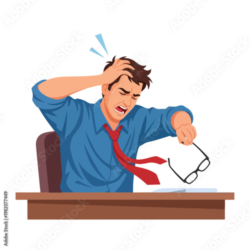 A stressed man in a shirt and tie sits at a desk clutching his head in frustration