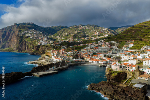Porto de Câmara de Lobos harbor, Câmara de Lobos Madeira Portugal colorful fishing port and coastal village on Atlantic shoreline.