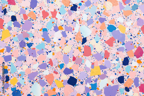 Bright playful terrazzo texture with speckles