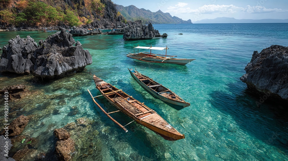 Fototapeta premium Boats near rocky outcrops in the Philippines.
