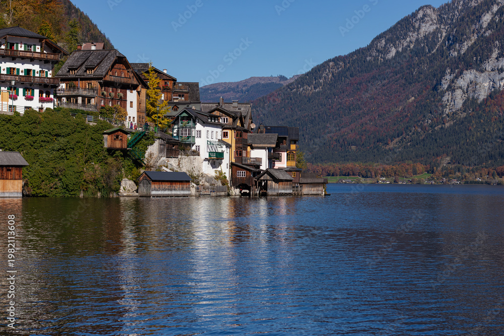 Fototapeta premium Picturesque Hallstatt Village with Traditional Houses on Lake Hallstatt and Autumn Mountains
