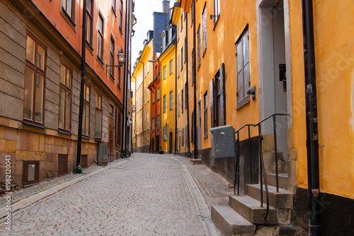 Photography Colorful narrow street in Gamla Stan old town, Stockholm, Sweden