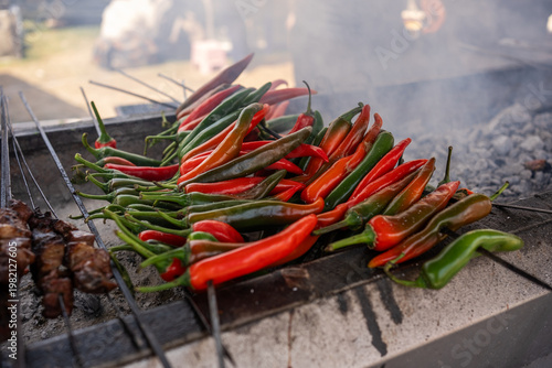Grilled Red and Green Chili Peppers on Barbecue with Smoke