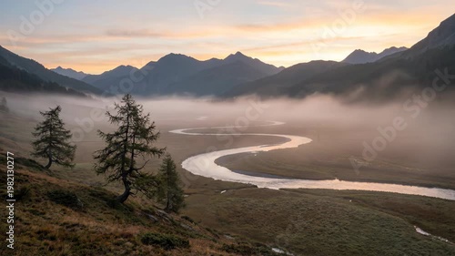 Misty Mountain Valley Sunrise with Winding River and Pine Trees.