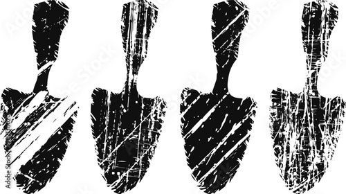 Set of four rustic garden trowels with textured handles and blades in black and white