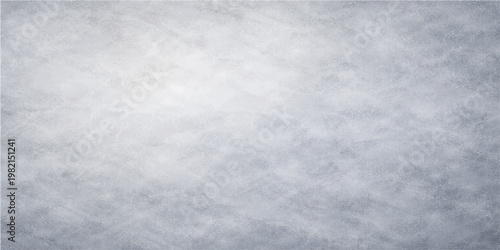 Fluffy white clouds drift across a blue winter sky above a cold snow pattern with an abstract grunge paper texture background
