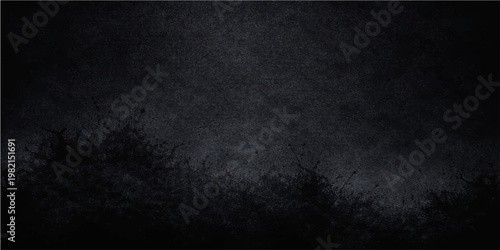 An empty dark grunge black and white wall texture with a rough vintage concrete surface and a dirty old paper pattern makes a perfect blank gray backdrop for a textured chalkboard design