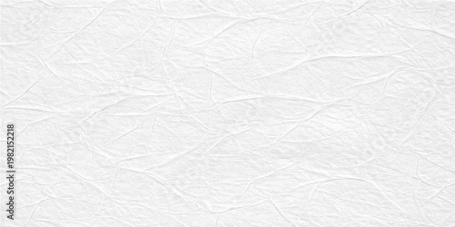 A vintage white crumpled paper sheet with a rough wrinkled surface and creased grunge texture creates a blank material backdrop for art and design
