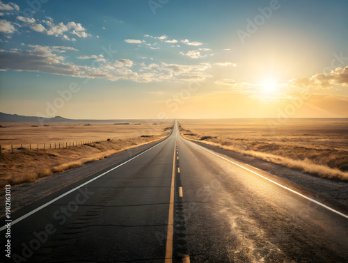 Cinematic low angle view of empty asphalt road receding into distance across vast arid plains under golden sunset sky with dramatic clouds
