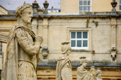 Stone statues of Roman warriors in Roman Baths complex in Bath, Somerset, England, UK. City of Bath  is a UNESCO World Heritage Site. 