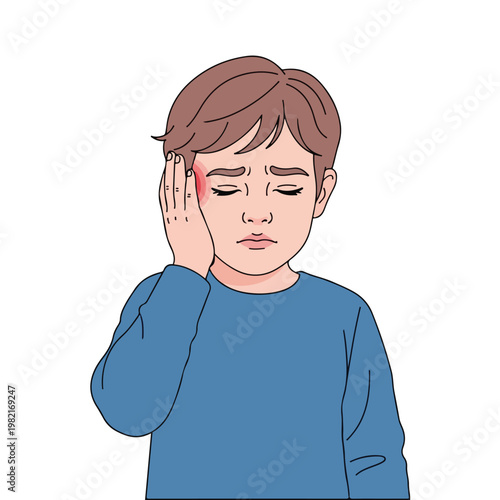 A young boy feeling distressed and holding his cheek due to a painful toothache