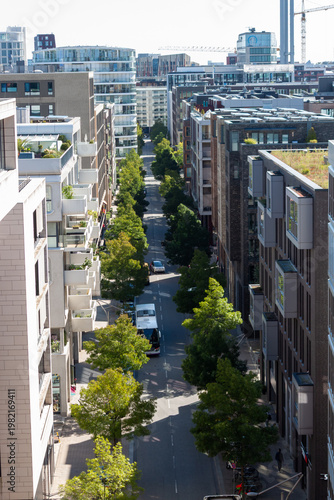 Aerial view of modern residential architecture and green streets in the Hafencity district under a clear sky, Hamburg
