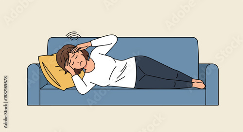 A woman lying on a sofa touches her head while suffering from a bad migraine