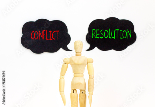 Resolution and conflict symbol. Concept words Resolution and Conflict on beautiful black speech bubbles. Beautiful white background. Businessman model. Social resolution conflict concept. Copy space.