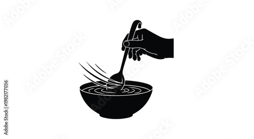 Hand holding a silver spoon stirs a bowl of liquid, creating a dynamic visual representation of food preparation, culinary craft, or home cooking processes within a professional kitchen setting.