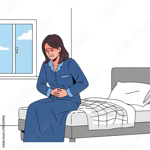 Woman in blue pajamas sitting on a bed clutching her stomach in pain or sickness