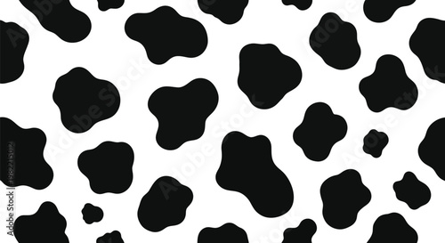 Seamless black and white cow print pattern with irregular organic spots for textile design