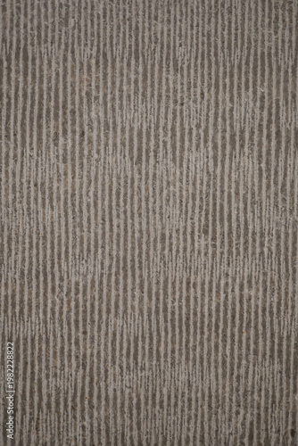 Obraz na płótnie Modern textured stone surface with vertical linear grooves.