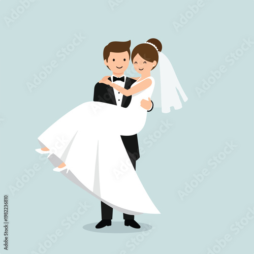 A groom in tuxedo carrying his smiling bride wearing white elegant wedding gown