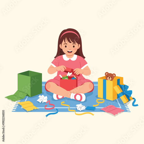 Young girl in a pink dress happily opens colorful gift boxes on a soft blue rug